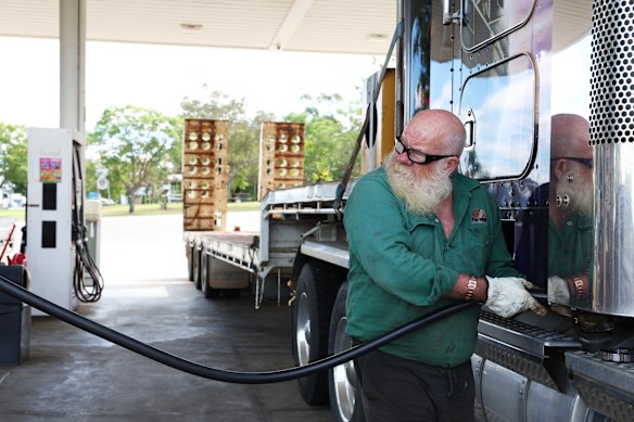 Truck driver Chris Gibbs fills up the tank. Australia's reliance on diesel has become a major problem in Iran's oil crisis.