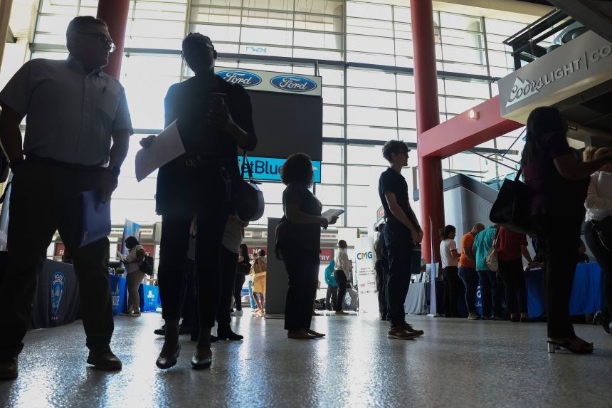 Job seekers attend a job fair held at Amerant Bank Stadium in Sunrise, Florida, on September 25, 2025.