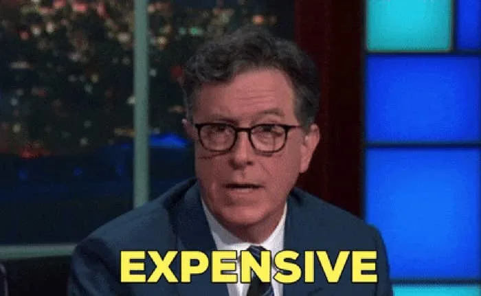 The man in the glasses and suit looks surprised, with the text "EXPECTATION" to cover the picture